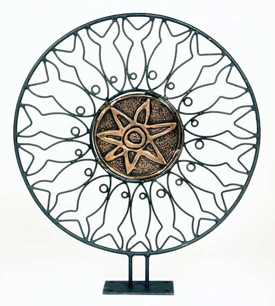 11. ROSONE. Bronzo e ferro, Ø 50 cm